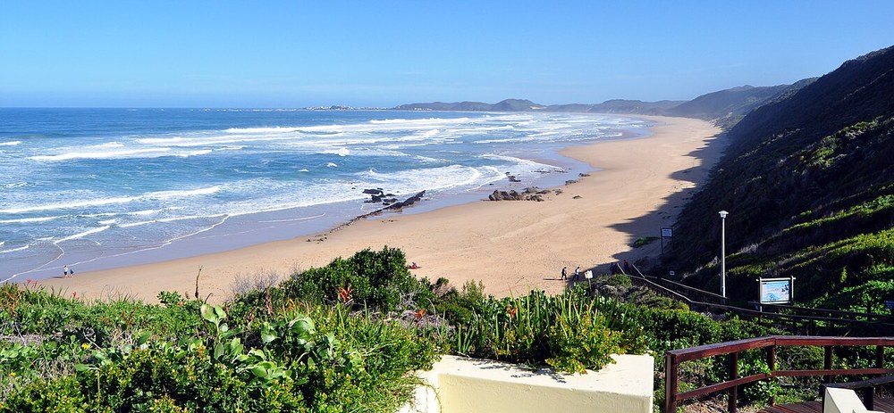 The beach at Brenton-on-Sea; representative setting, not Brenton Sea Cottages